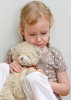 depositphotos_13790517-Sad-lonely-little-girl-sitting-with-teddy-bear-near-the-wall.jpg